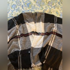 Women’s plaid shawl cape with toggle.